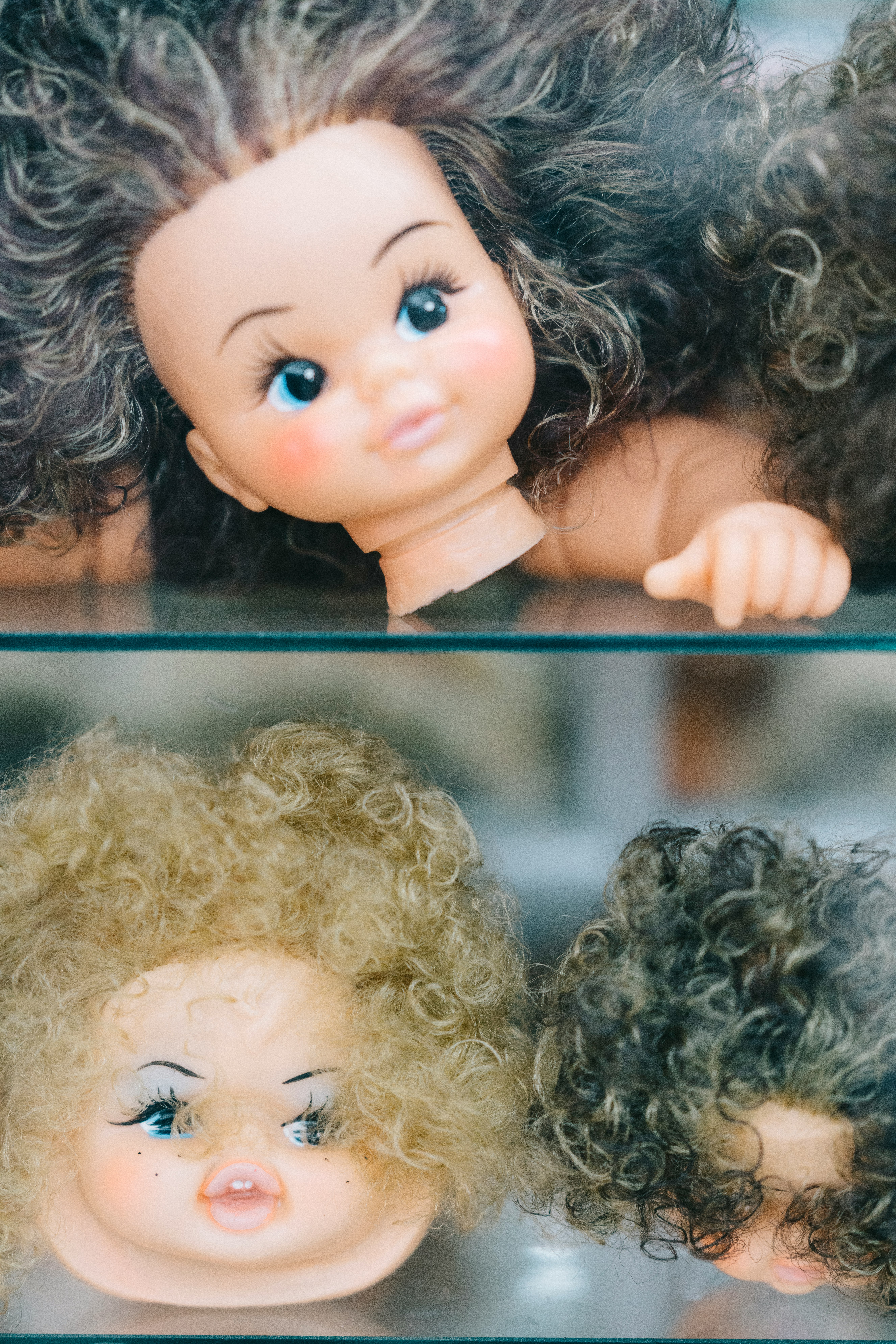 female doll heads collage